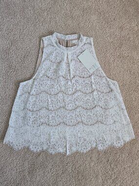 White lace sleeveless high low top